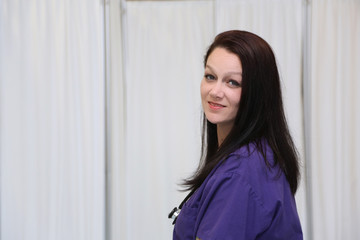 Side profile portrait of attractive young female healthcare professional with copy space