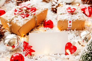 Christmas and New year background with presents, ribbons, balls and clear paper for text.