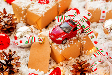Christmas and New year background with toy car present with ribbon and clear tag for text.