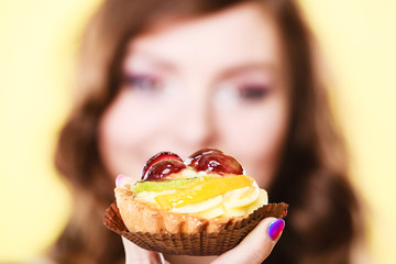 Cupcake cake in woman hand. Sweet food.