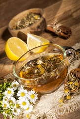 Chamomile tea on wooden background