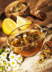 Chamomile tea on wooden background