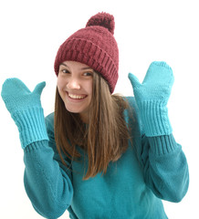 Beautiful  girl in colorful winter clothes on white background