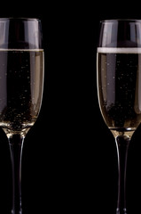 A glass of champagne on black background