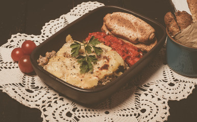 Homemade Moussaka served with bread and chutney (East European cuisine)