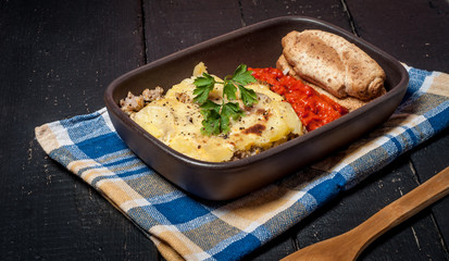Homemade Moussaka served with bread and chutney (East European cuisine)