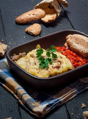 Homemade Moussaka served with bread and chutney (East European cuisine)