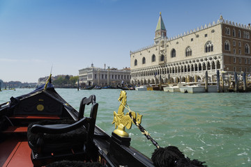 View from gondola trip during the ride through the canals with San Marco district background in Venice Italy © tolgaildun
