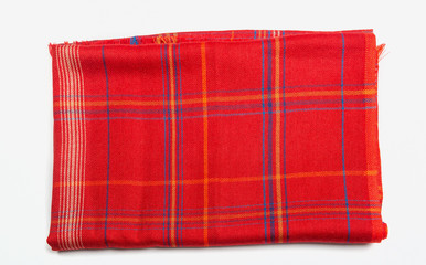 Red folded indian scarf isolated