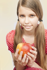 Teenage girl with apple