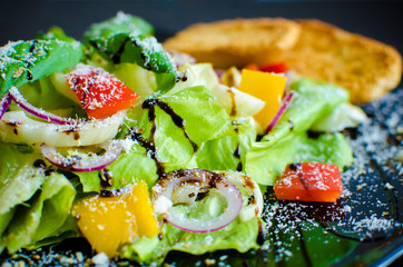 Fresh vegetable salad with breads. Italian food.