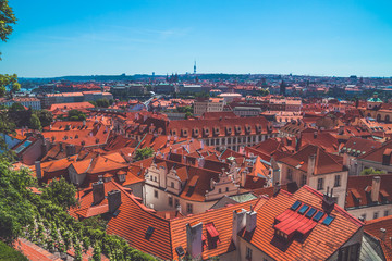 Fototapeta na wymiar Panoramic view over tile roof tops in Prague, Czech Republic