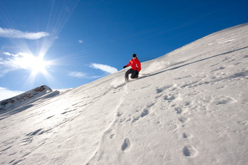 Young man skiing in powder snow