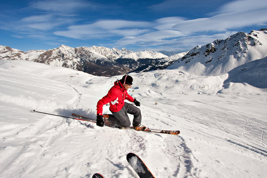 Young man skiing in powder snow