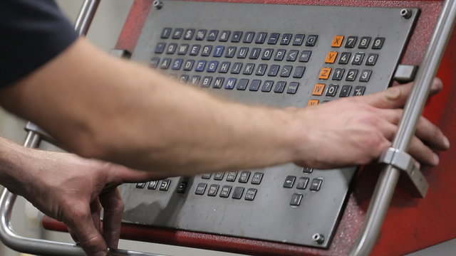 Programming a CNC machine.