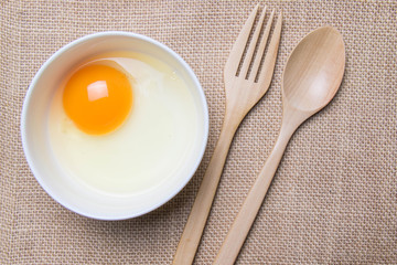 raw egg ia a white bowl