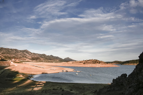 andscape of Alange Reservoir with boarding pontoons and boats, S