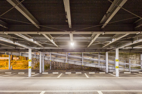 Empty outdoor car parkig space at night time