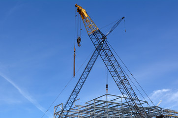 Fototapeta na wymiar Cranes in construction site