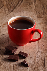 Hot chocolate and chocolate pieces.