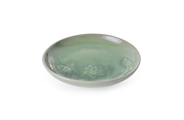 shiny coated ceramic plate on white background