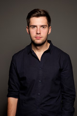 Obraz premium portrait of a young man on a gray background