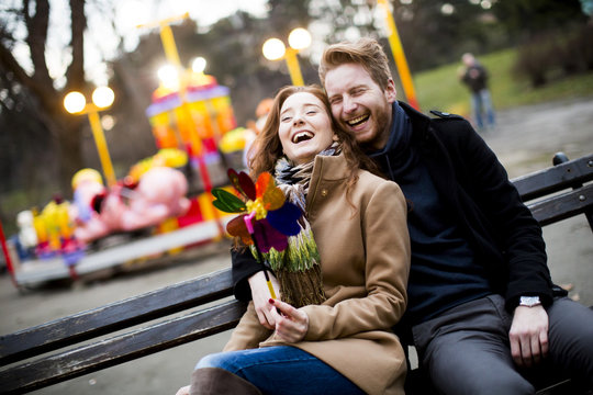 Young couple in the amusement park