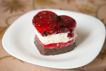 Valentine cupcake. cake in the shape of a heart on a white plate. Heart shaped cake
