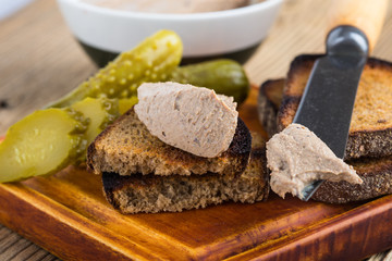 Homemade chicken liver pate  on rustic wooden table