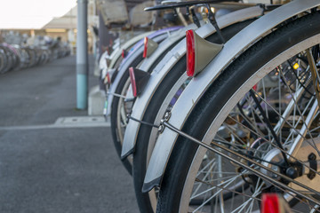 Lot of Bicycles parking at train station in Japan.