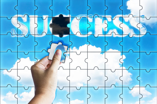 Business concept successful, hand fulfil word success on sky bac