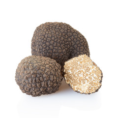 Black truffles and half isolated on white, clipping path