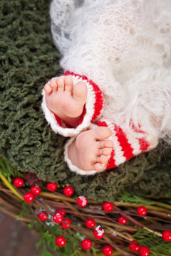 Close up picture of new born baby feet, christmas time