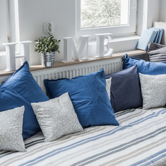 White and blue bedding set on the bed