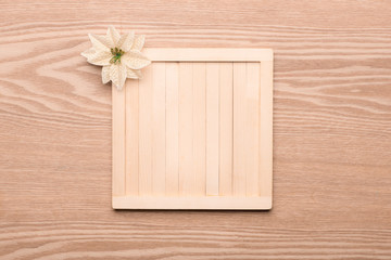 Beautiful christmas background: Collection of wooden Christmas objects isolated on fir branches on wooden background with copyspace. View from above