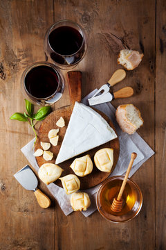 Cheese plate Assortment of various types of cheese and honey on