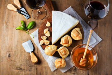 Fototapeta na wymiar Cheese plate Assortment of various types of cheese and honey on
