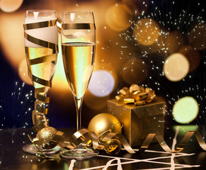 Toasting with champagne glasses against holiday lights