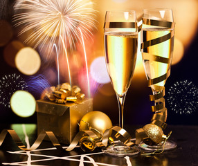 Toasting with champagne glasses against holiday lights