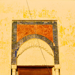   yellow window in morocco africa old construction and brown wal