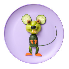 Happy vegetable mouse on pink plate and white background