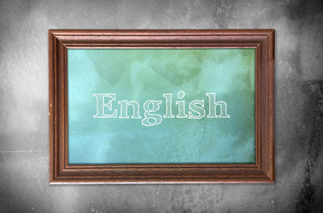 Picture frame with word of "English" cement wall background