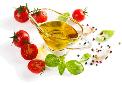 olive oil with fresh basil leaves and tomatoes