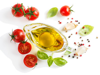 View of above of olive oil with fresh basil leaves and tomatoes