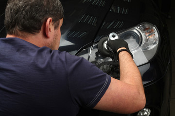 Car service. Polishing of optics of the car