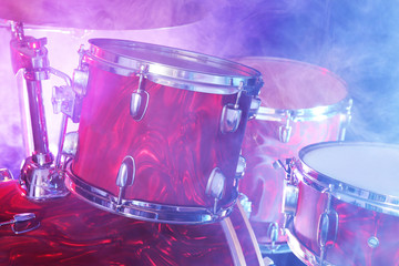 Drum set in smoke on a stage