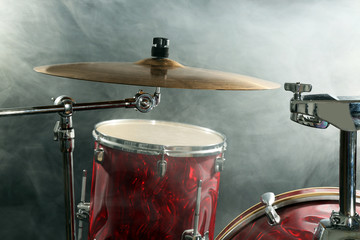 Drum set in smoke on a stage