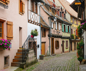 Half-timbered houses on a narrow street in Eguisheim, Alsace, France