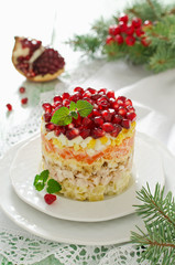 Layered salad from vegetables on the holiday table