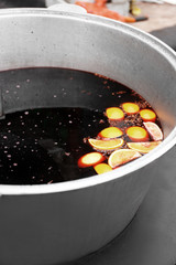 Tasty mulled wine in bowl closeup